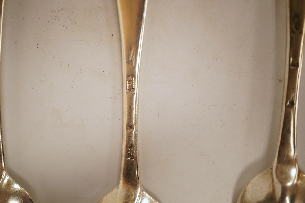 A matched set of seven Queen Anne silver Hanoverian pattern dessert spoons, maker's mark rubbed, five London, 1708, 17.5cm, together with seven other silver base mark Hanoverian pattern dessert spoons, various dates and
